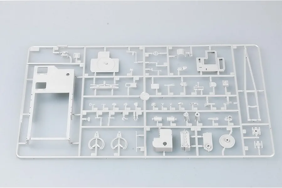A light grey plastic model kit sprue containing various small tank parts for a 1/35 scale military vehicle model.