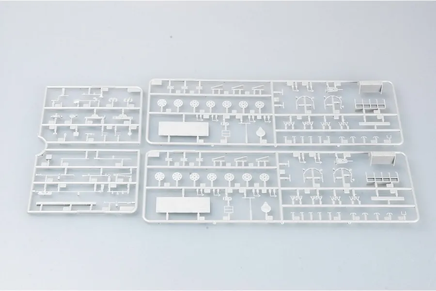 Three grey plastic model kit sprues containing various small parts for a 1/35 scale military vehicle model.