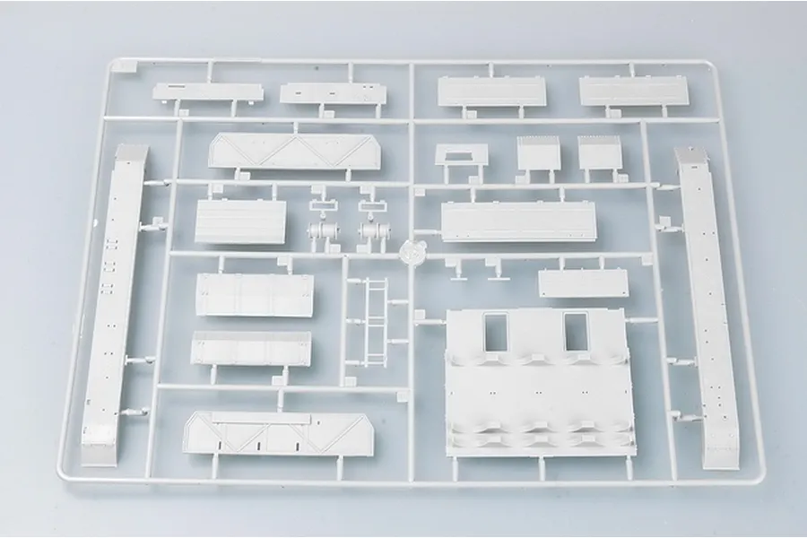 A grey plastic sprue containing various tank model parts for a 1/35 scale German Pz.Kpfw IV model kit.