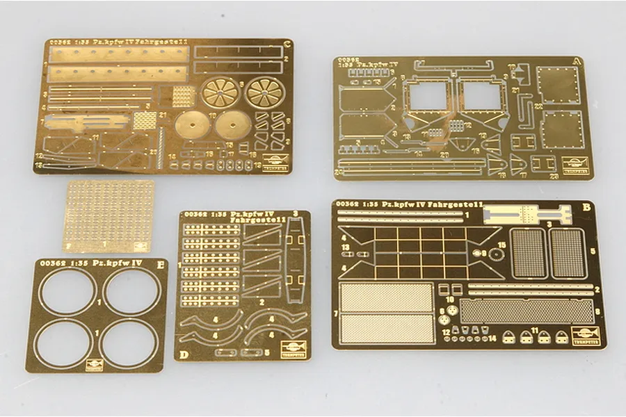 Six photo-etched brass detail sheets for a 1/35 scale Trumpeter German Pz.Kpfw IV model kit, laid out on a light grey surface.