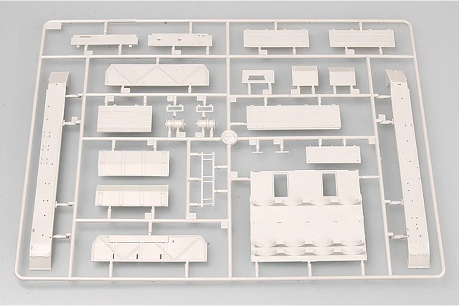 A grey plastic sprue containing various unpainted model tank parts for a 1/35 scale German Pz.Kpfw IV model kit.