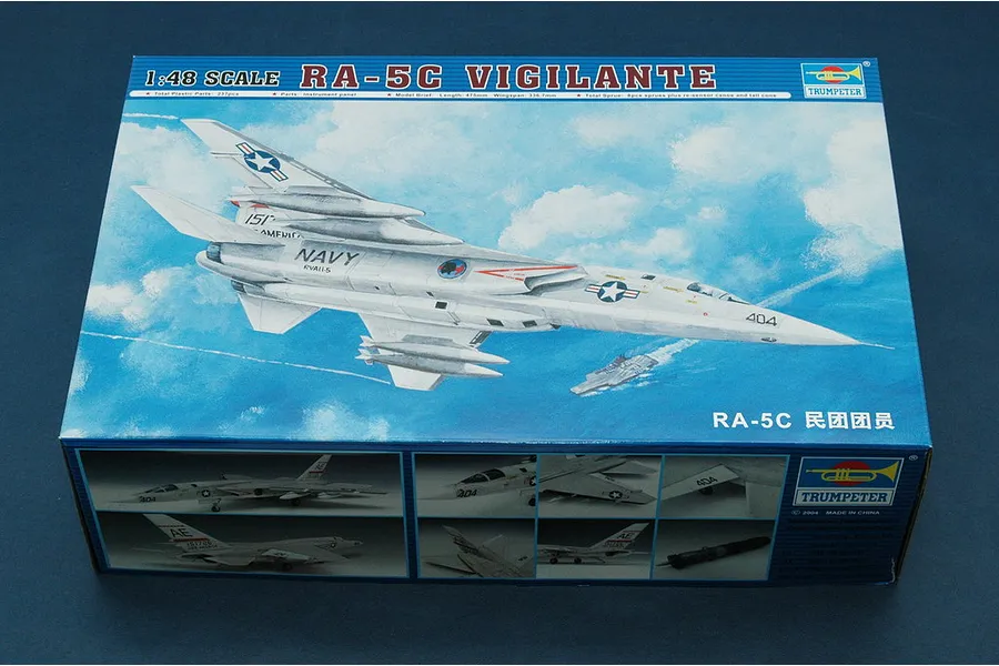 A Trumpeter 1/48 scale RA-5C Vigilante model kit box featuring an illustration of the jet flying over an aircraft carrier.