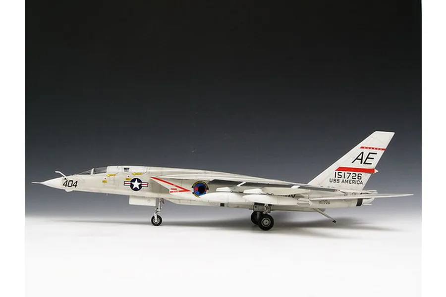 A side-profile view of a completed 1/48 scale Trumpeter RA-5C Vigilante model aircraft, finished in white with US Navy markings.