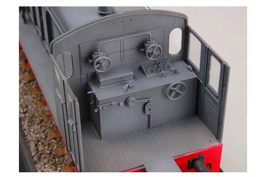 Close-up of the interior cab of a 1/35 scale German WR 360 C12 locomotive model kit showing control wheels and levers.