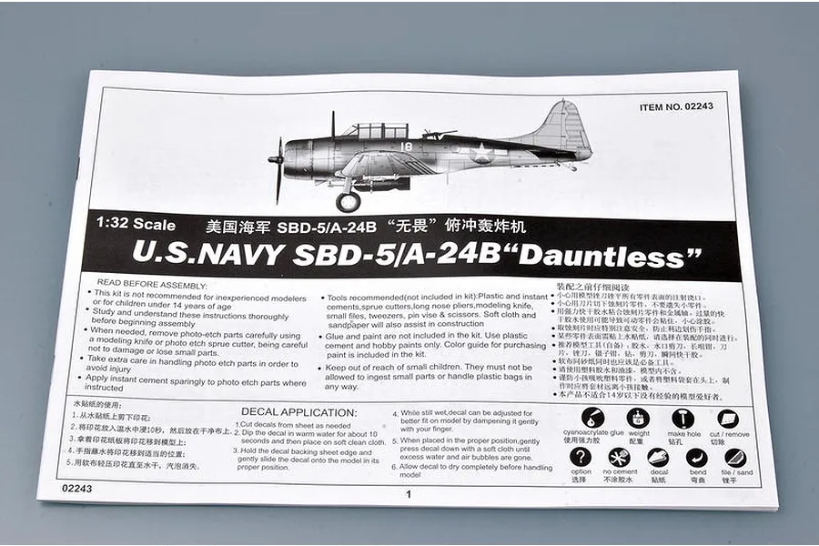 The first page of the instruction manual for the Trumpeter 1/32 scale U.S. Navy SBD-5/A-24B Dauntless model kit, showing assembly warnings and decal application.