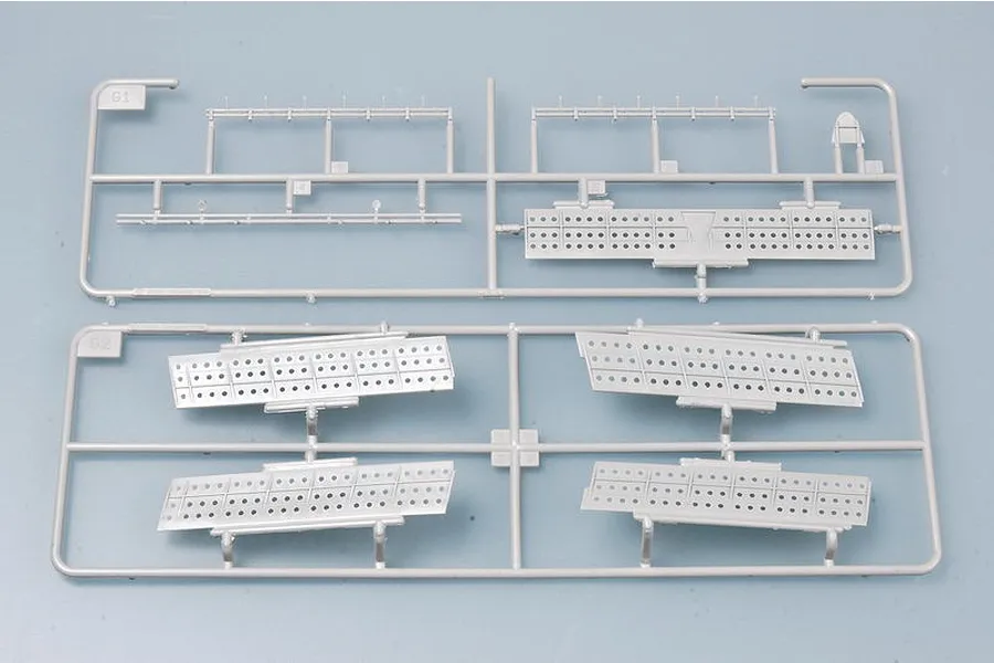 Two grey plastic model kit sprues labeled G1 and G2, featuring perforated dive brake panels for a 1/32 scale aircraft model.