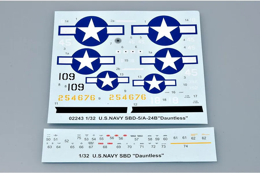 Two decal sheets for a 1/32 scale Trumpeter U.S. Navy SBD-5/A-24B Dauntless model kit, featuring various national insignia, numbers, and technical markings.