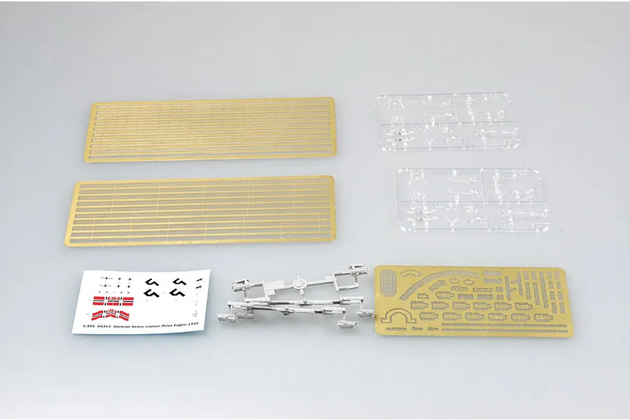 A collection of photo-etched metal parts, clear plastic sprues, and a decal sheet for the Trumpeter 1/350 scale German Prinz Eugen 1945 model kit.