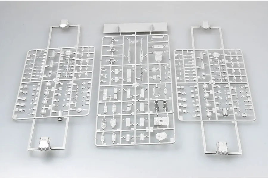Three grey plastic model kit sprues containing various small parts for a 1/350 scale ship model, laid out on a plain light grey background.