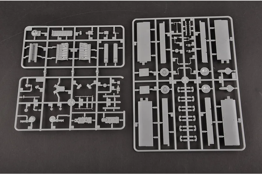 Two grey plastic model kit sprues containing various aircraft parts for a Trumpeter 1/32 scale model kit.
