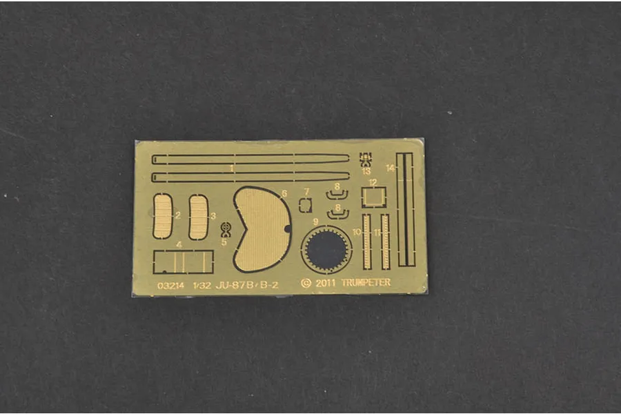 A photo-etched brass detail sheet for a 1/32 scale Trumpeter Junkers Ju-87B-2 Stuka model kit, featuring various numbered parts on a dark background.