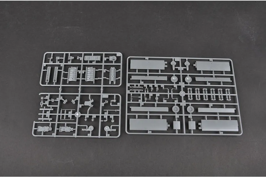 Two grey plastic model kit sprues containing various aircraft parts for a Trumpeter Junkers Ju-87B-2 Stuka model kit.