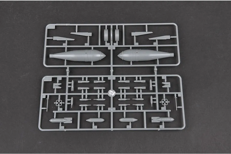 A grey plastic sprue containing various model aircraft bomb and ordnance parts for a 1/32 scale model kit.