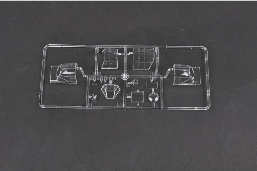 A clear plastic sprue containing various canopy and cockpit window parts for a 1/32 scale model aircraft kit.