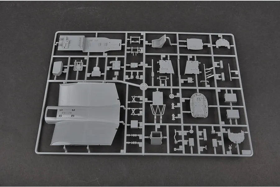 A grey plastic sprue containing various model aircraft parts for a Junkers Ju-87B-2 Stuka, including a large wing section and cockpit components.