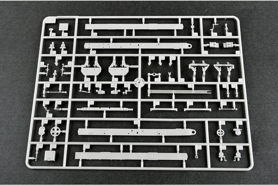 A grey plastic sprue containing various unpainted model kit parts for the Trumpeter 1/35 Russian AT-S Artillery Tractor.