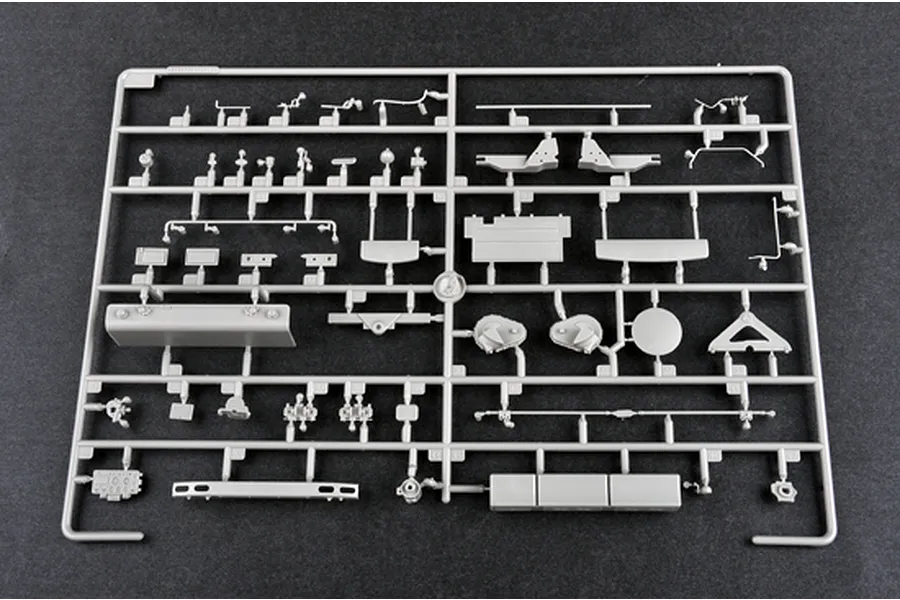 A grey plastic model kit sprue containing various small parts for the Trumpeter 1/35 Russian AT-S Artillery Tractor model.