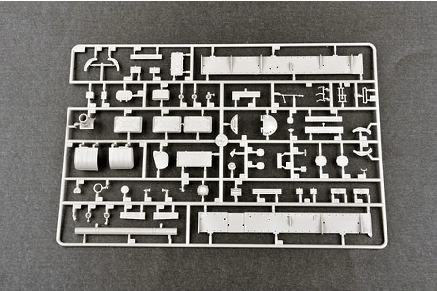 A grey plastic sprue containing various unpainted model tank parts for a 1/35 scale T-62 BDD model kit.