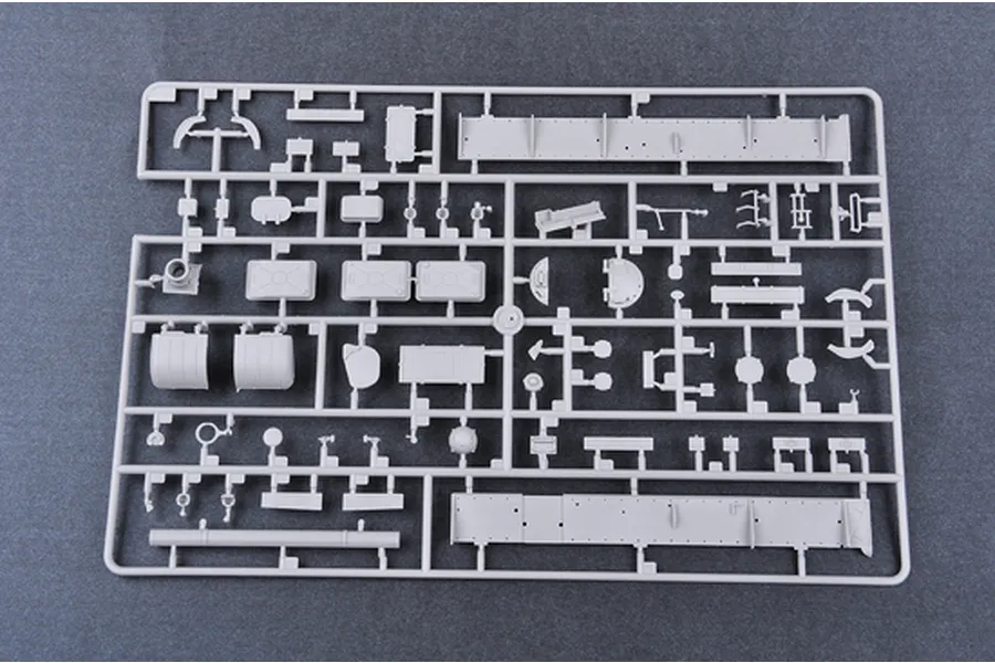 A grey plastic sprue containing various unpainted model tank parts for a 1/35 scale military model kit.