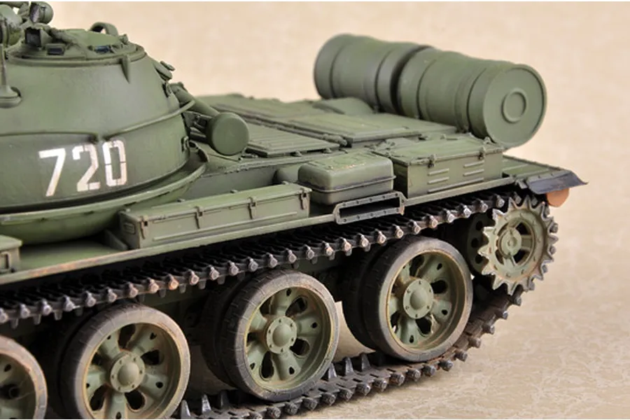Close-up of a 1/35 scale model T-62 tank painted in olive green with the number 720 on the turret.