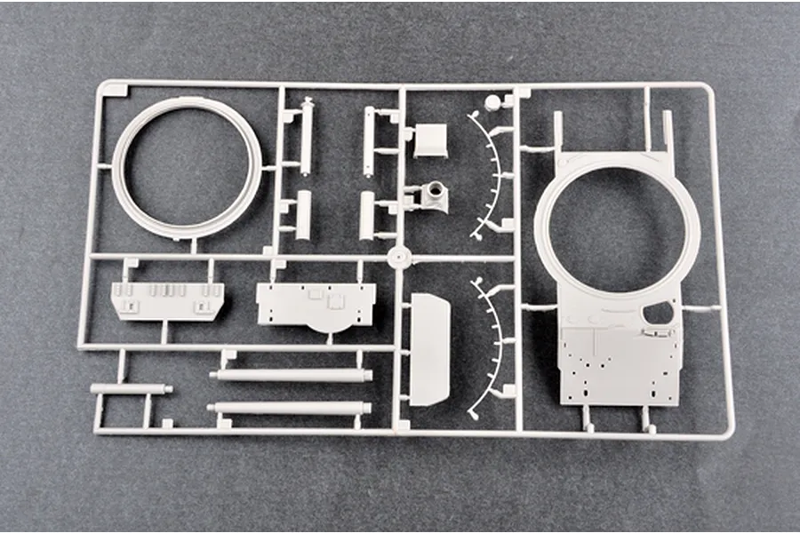 A grey plastic model kit sprue containing tank turret and hull components for a 1/35 scale model.