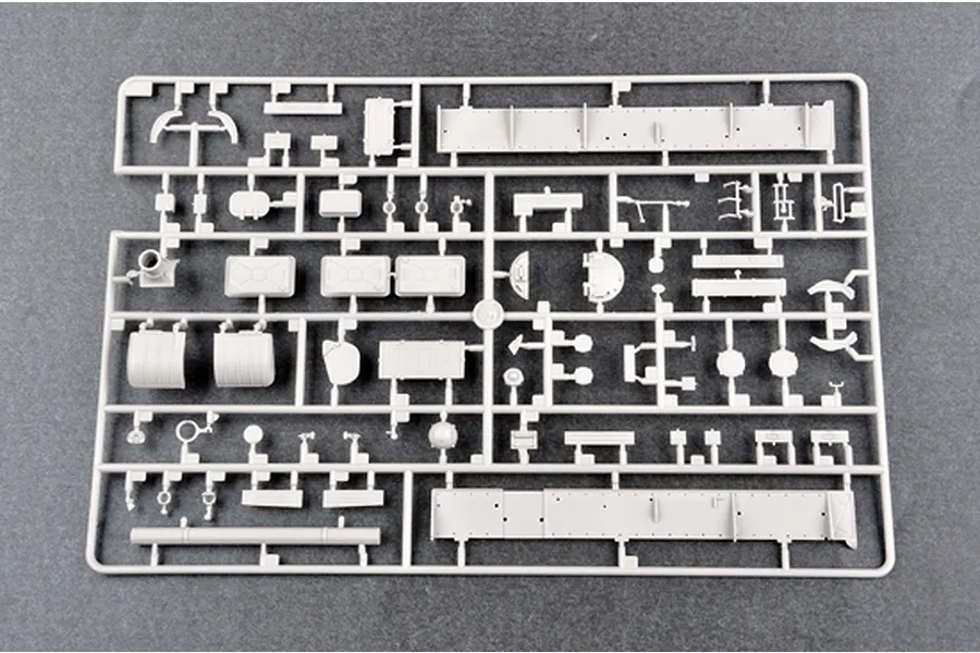 A grey plastic sprue containing various unpainted model tank parts for a 1/35 scale Russian T-62 tank model kit.
