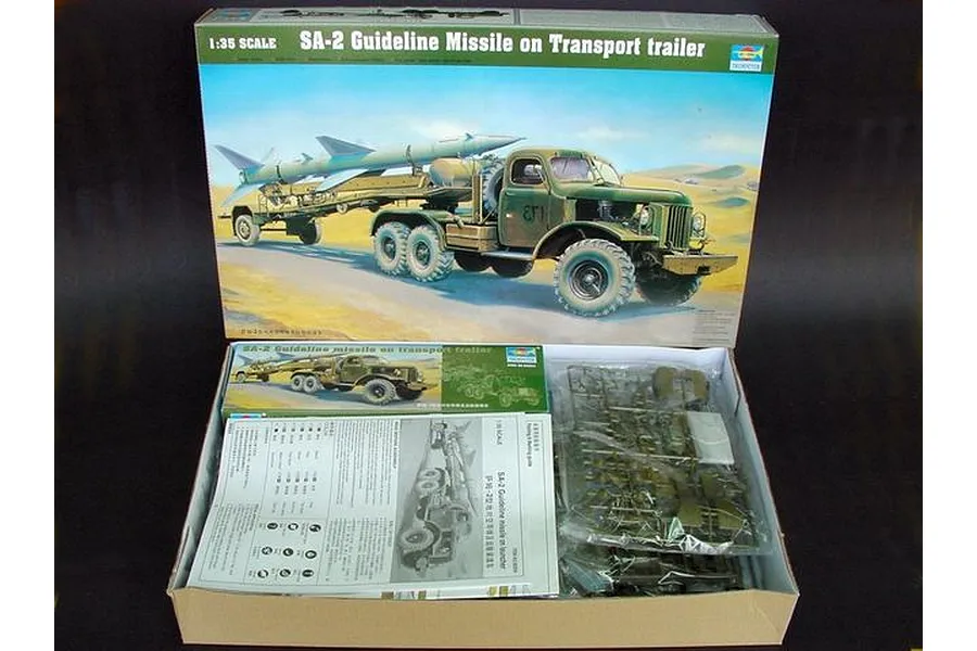 Open box of Trumpeter 1/35 scale SA-2 Guideline Missile model kit showing box art, instruction manual, and plastic sprues in bags.