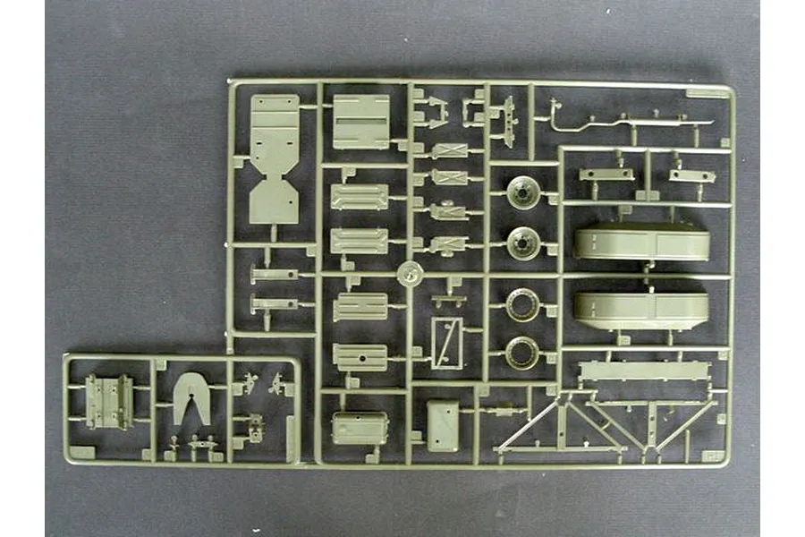 An olive green plastic model kit sprue containing various vehicle parts for a Trumpeter 1/35 scale model.