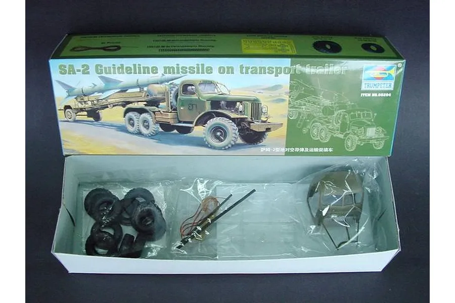 Open box of Trumpeter 1/35 scale SA-2 Guideline missile model kit showing box art and plastic parts in bags.