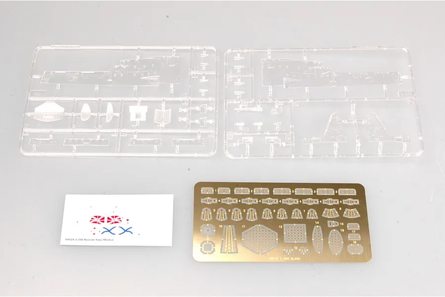 Two clear plastic model sprues, a small decal sheet, and a brass photo-etched detail sheet for the Trumpeter 1/350 Russian Navy Moskva model kit.