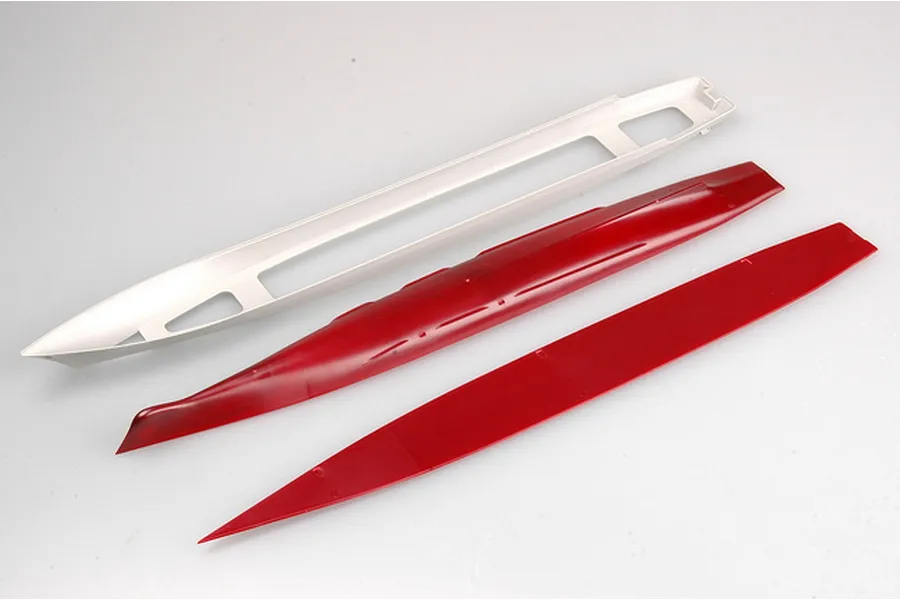 Plastic model kit parts for a ship, including a grey hull frame and two red hull sections on a white background.