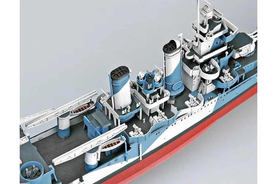 A high-angle view of a detailed 1/350 scale plastic model of the USS San Francisco heavy cruiser, showing the deck, funnels, and superstructure.