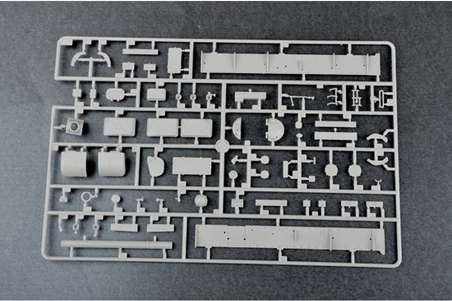 A grey plastic sprue containing various small model tank parts for a 1/35 scale military model kit.