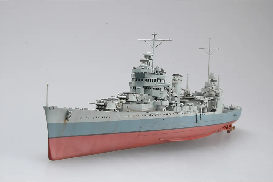 A completed 1/350 scale plastic model of the USS San Francisco CA-38 heavy cruiser, featuring a grey and red hull on a plain white background.