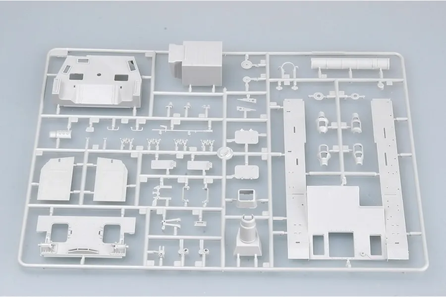 A grey plastic sprue containing various unpainted model tank parts for a 1/35 scale Trumpeter Dicker Max kit.