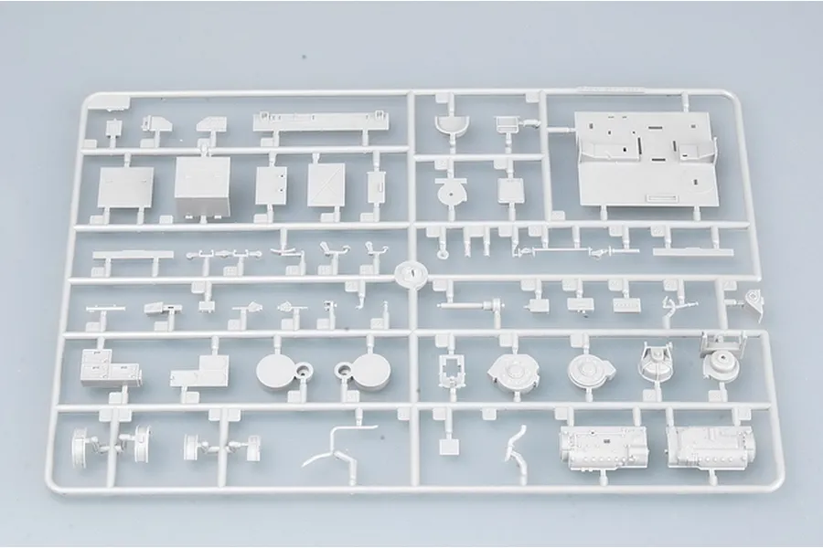 A grey plastic sprue containing various unpainted model kit parts for a 1/35 scale military vehicle.