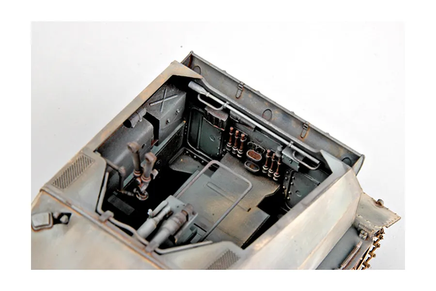 High-angle view of the detailed open fighting compartment of a 1/35 scale Dicker Max self-propelled gun model kit.