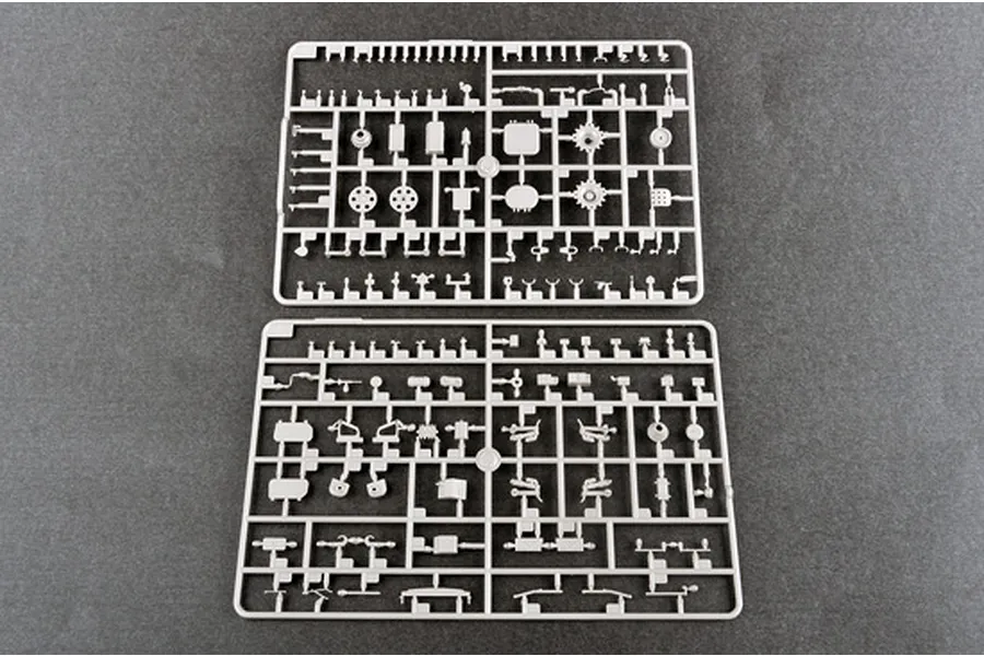 Two grey plastic model kit sprues containing various small parts for a 1/35 scale military vehicle model.