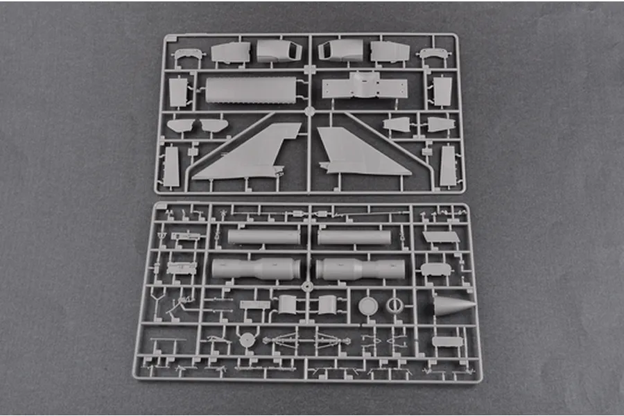 Two grey plastic model kit sprues containing various aircraft parts for a Trumpeter 1/48 F-106B Delta Dart model.