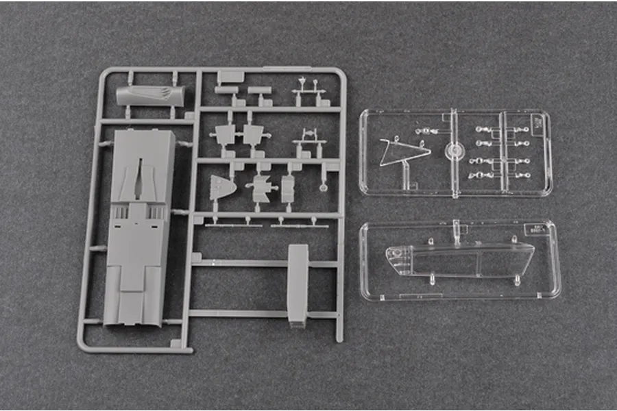 Plastic model kit sprues for the Trumpeter 1/48 F-106B Delta Dart, showing grey airframe parts and clear canopy components.