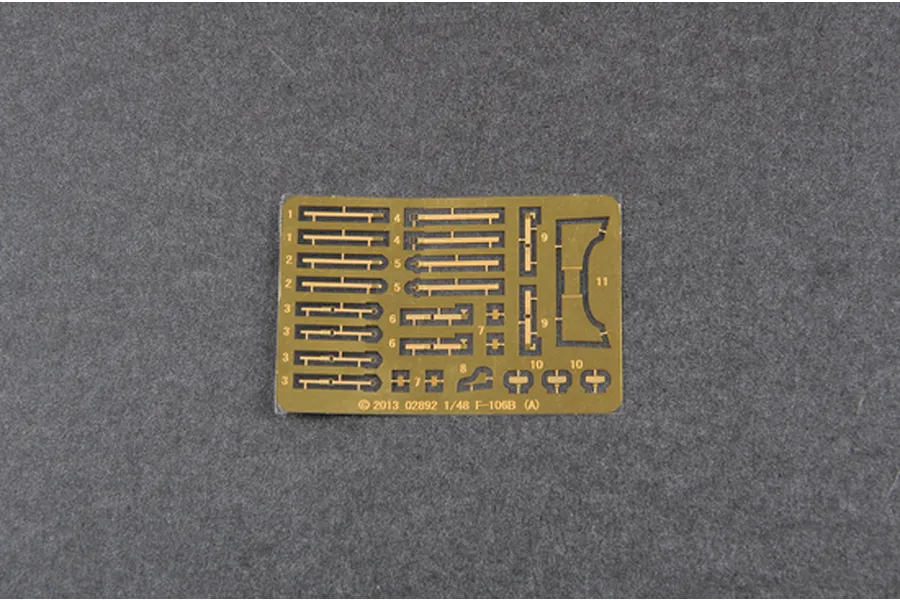 A photo-etched brass fret for a 1/48 scale Trumpeter F-106B model kit, featuring numbered parts on a grey background.