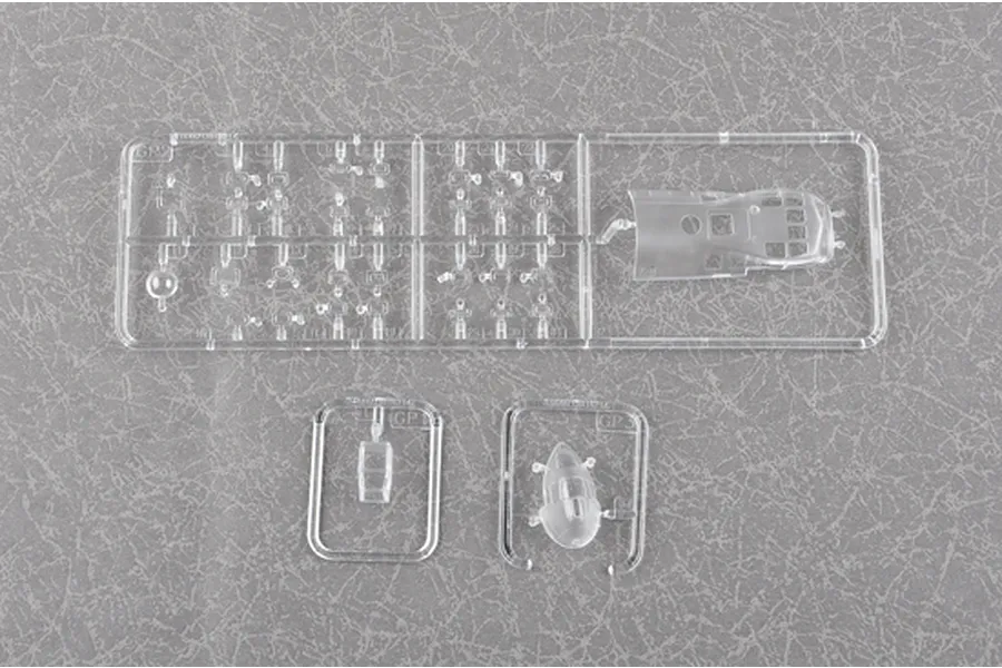 Clear plastic model kit sprues for the Trumpeter 1/72 Be-6 Madge aircraft, showing cockpit canopy and small detail parts.