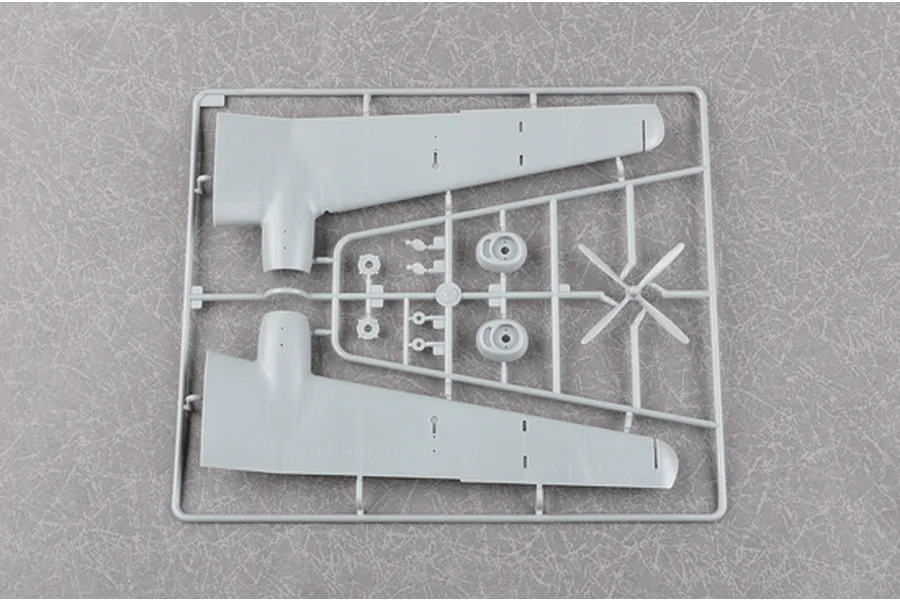 A grey plastic model aircraft wing sprue from the Trumpeter 1/72 Be-6 Madge kit, featuring two wing sections and propeller parts.