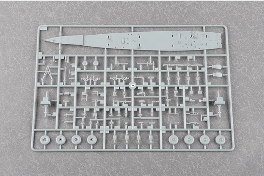 A grey plastic sprue from a Trumpeter 1/72 scale model kit containing various aircraft parts including a fuselage section and wheels.