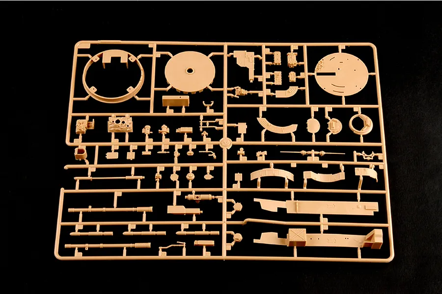 A tan plastic model kit sprue containing various tank parts for a 1/35 scale Russian BMP-3 model, set against a black background.