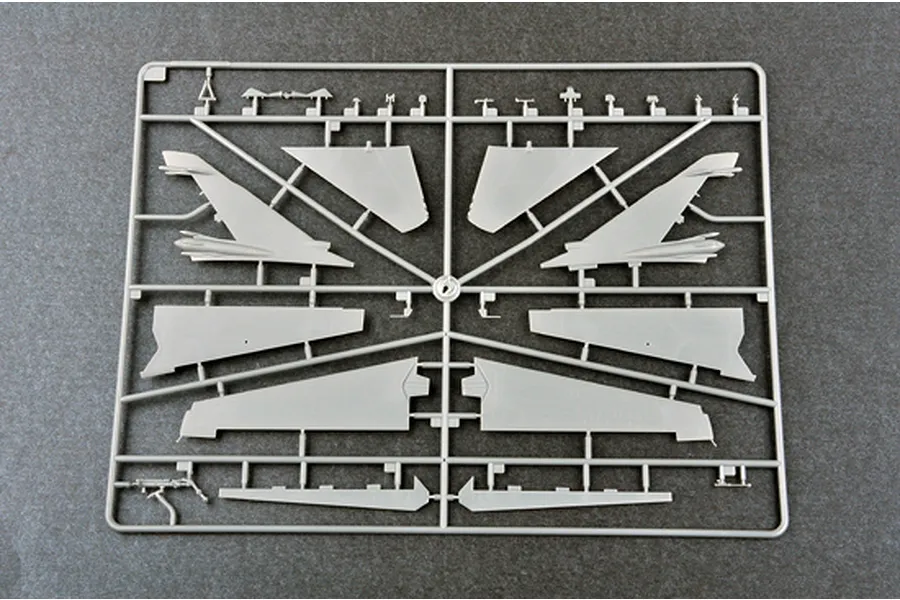 A grey plastic sprue containing various aircraft wing and tail components for a 1/72 scale model kit.