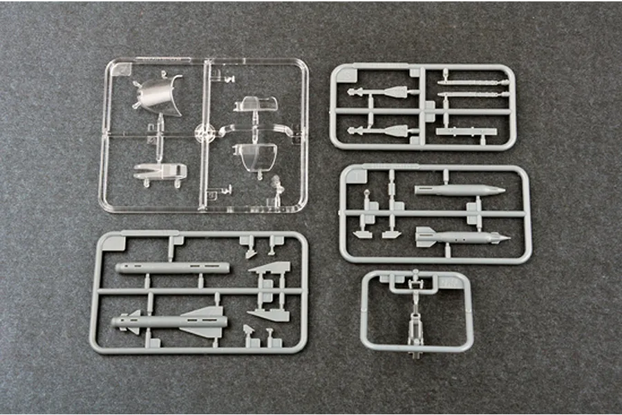 Plastic model kit sprues for the Trumpeter 1/72 Su-24M Fencer-D, including clear canopy parts and grey weapon components.
