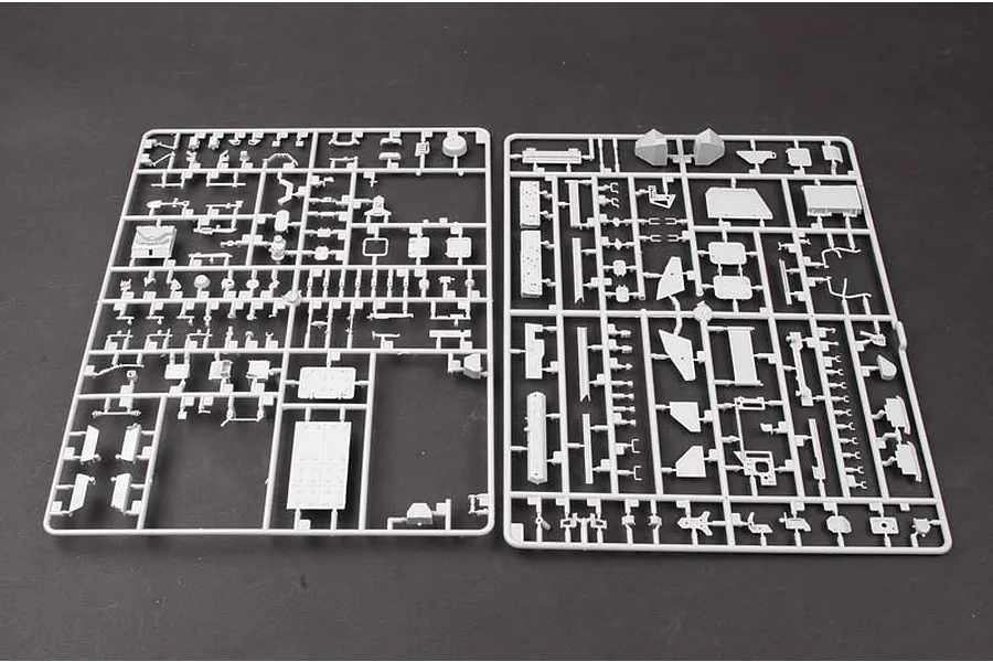 Two grey plastic model kit sprues containing various small parts for a 1/35 scale LAV-III armoured vehicle model.