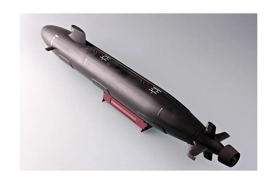 A high-angle studio shot of a finished 1/144 scale Trumpeter USS Seawolf SSN-21 submarine model kit on a red display stand.