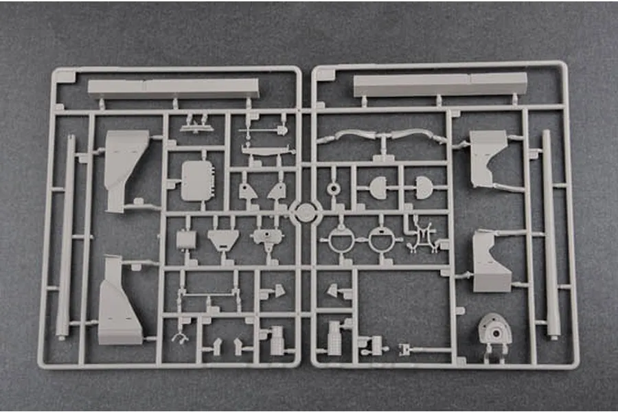 A grey plastic sprue containing various unpainted model tank parts for a 1/35 scale kit.